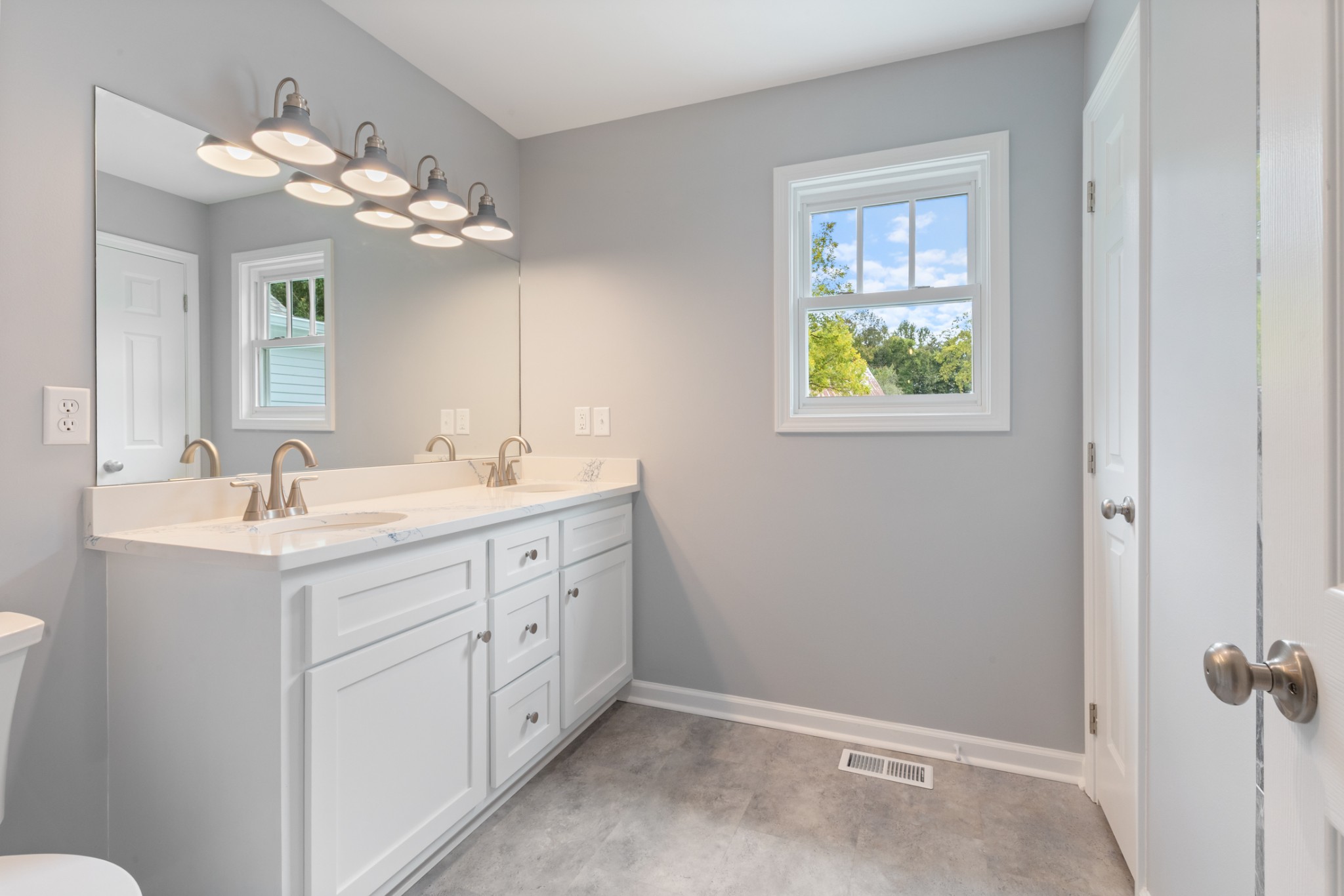 260 Old Highway 48 Charlotte, TN 37036 - Photo 17 of 71 a bathroom with a double vanity sink and a mirror