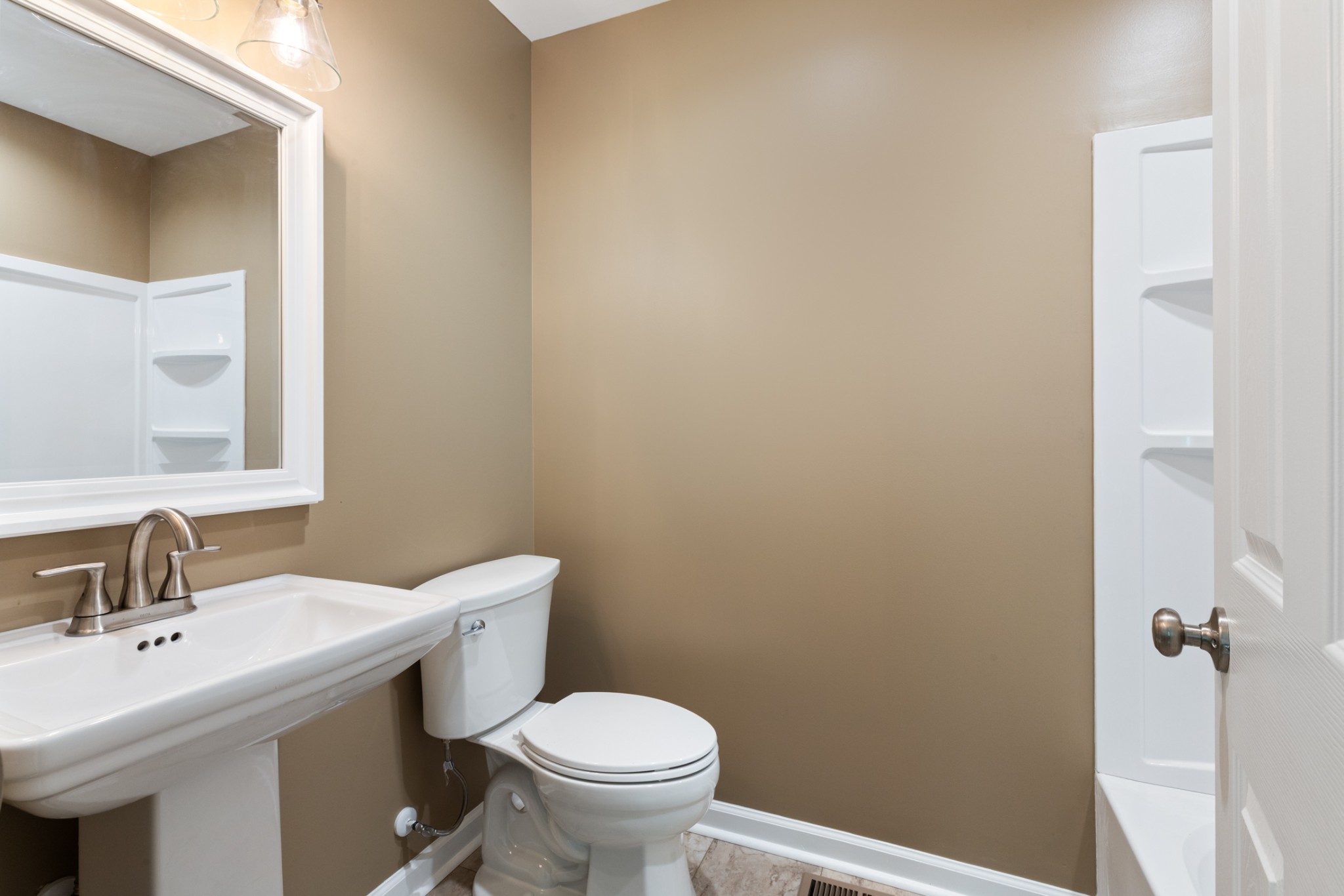 260 Old Highway 48 Charlotte, TN 37036 - Photo 22 of 71 a bathroom with a sink toilet and a mirror