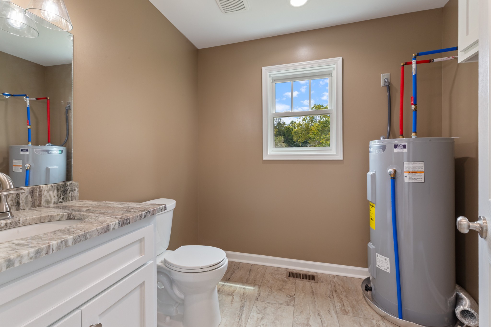 260 Old Highway 48 Charlotte, TN 37036 - Photo 28 of 71 a bathroom with a granite countertop toilet sink and tub