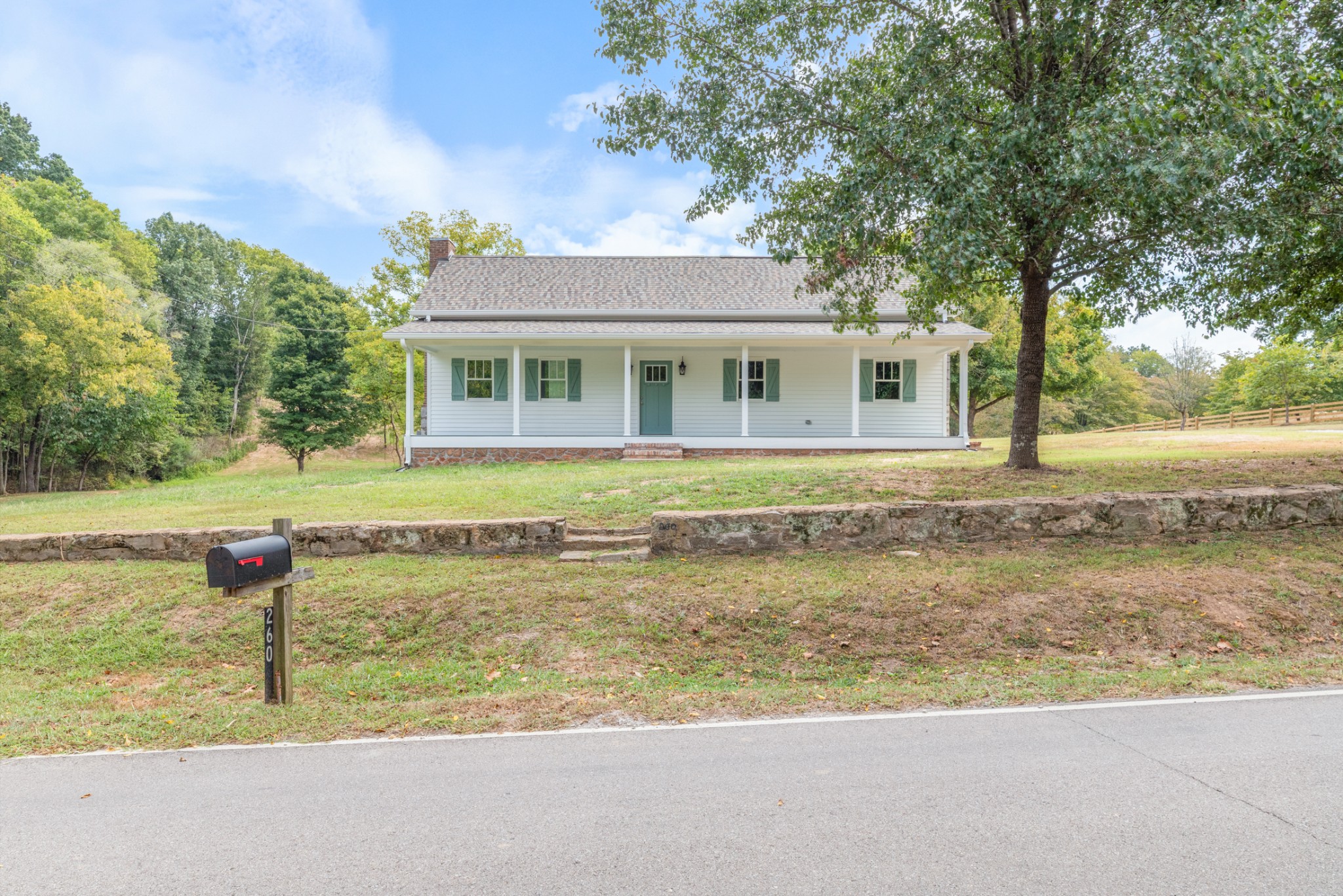 260 Old Highway 48 Charlotte, TN 37036 - Photo 32 of 71 a front view of a house with a yard and trees