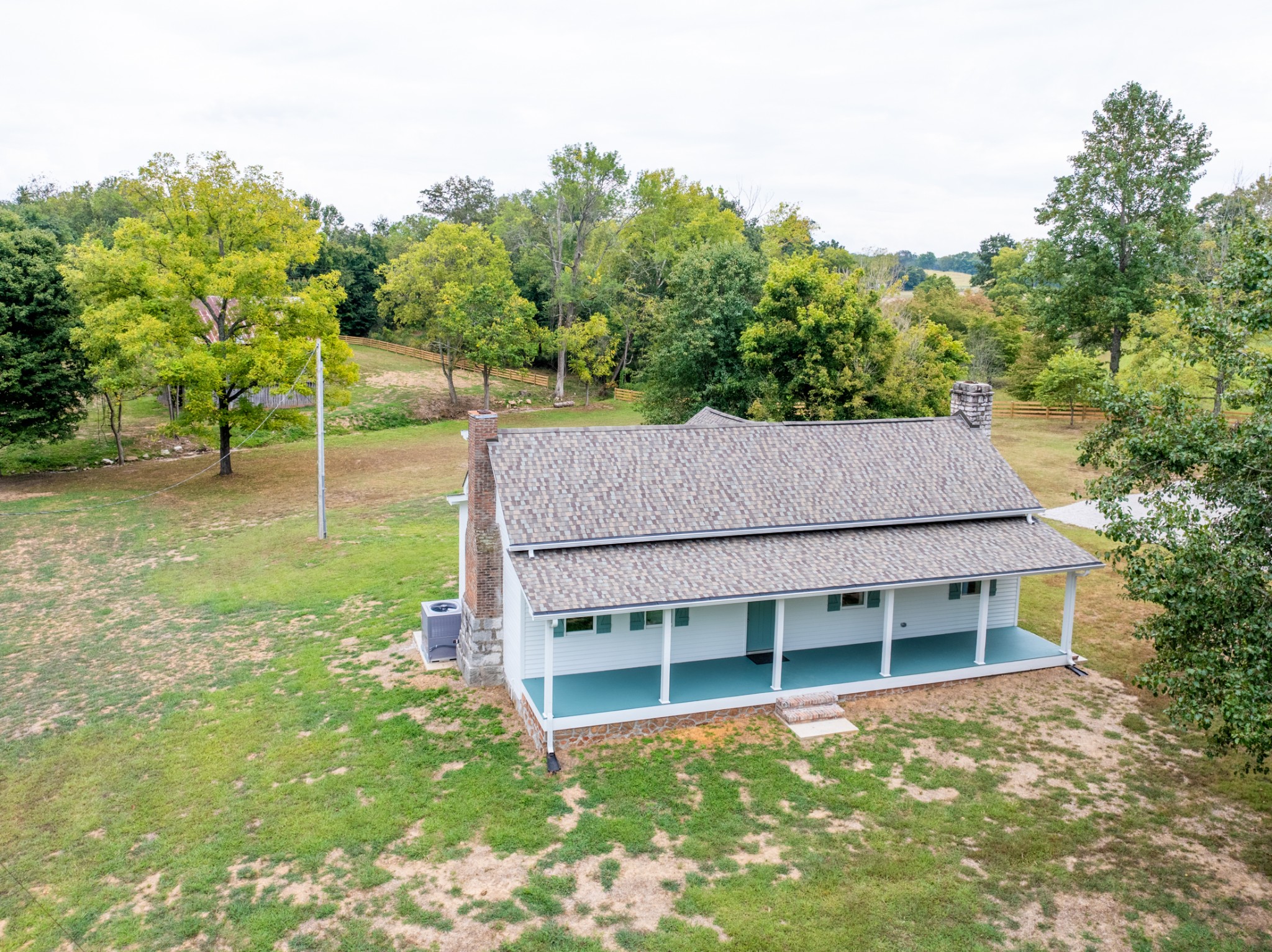 260 Old Highway 48 Charlotte, TN 37036 - Photo 36 of 71 a aerial view of a house next to a big yard and large trees