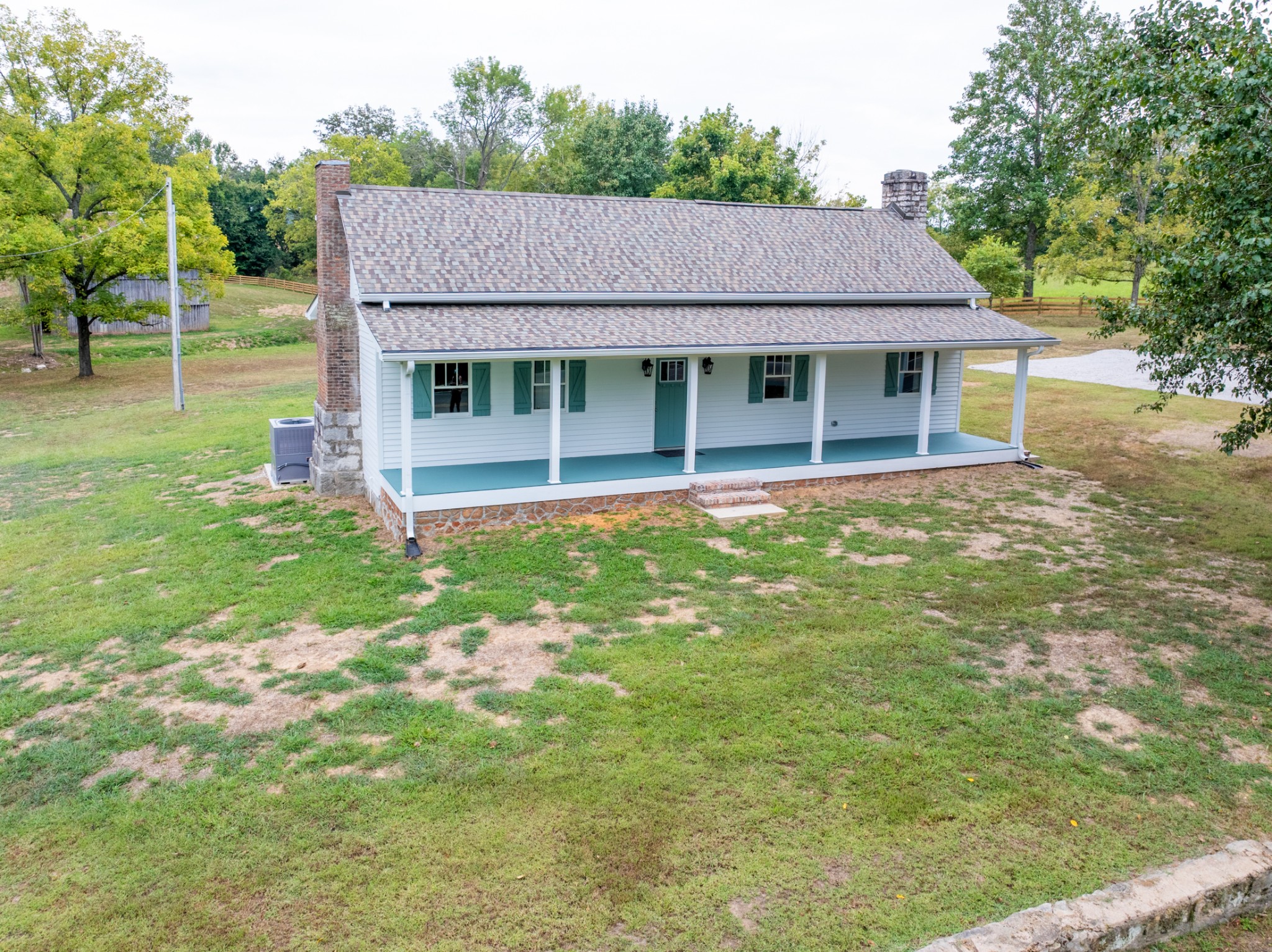 260 Old Highway 48 Charlotte, TN 37036 - Photo 37 of 71 a aerial view of a house next to a big yard and large trees