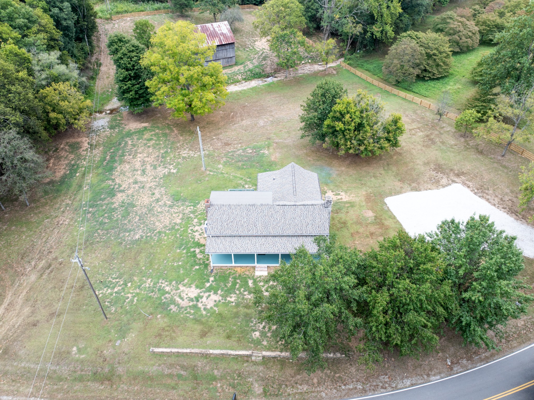 260 Old Highway 48 Charlotte, TN 37036 - Photo 53 of 71 an aerial view of a house with a yard and a large pool