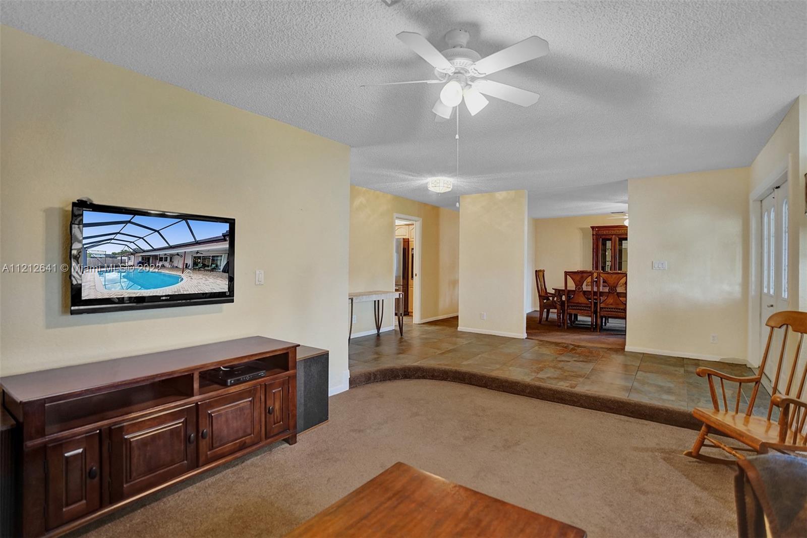 7420 Southwest 15th Street Plantation, FL 33317 - Photo 11 of 60 a living room with furniture and a flat screen tv