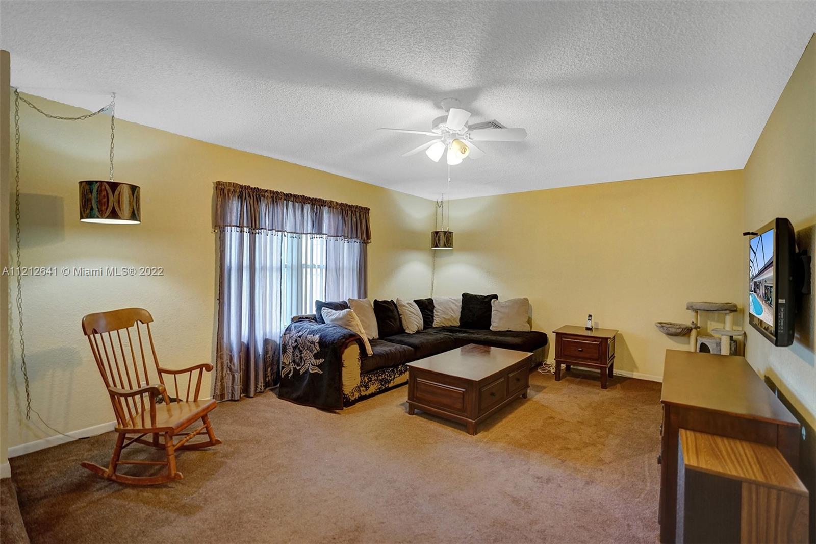 7420 Southwest 15th Street Plantation, FL 33317 - Photo 13 of 60 a living room with furniture and a flat screen tv