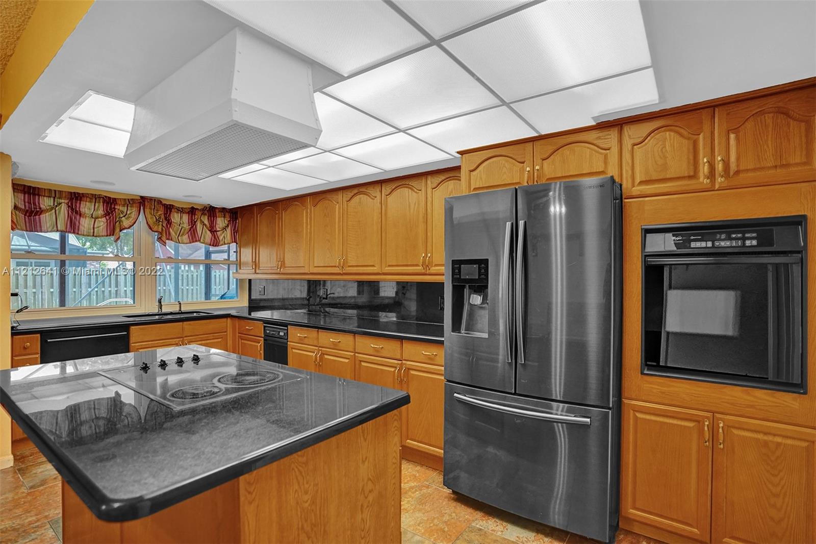 7420 Southwest 15th Street Plantation, FL 33317 - Photo 18 of 60 a kitchen with stainless steel appliances granite countertop a refrigerator a stove and a sink