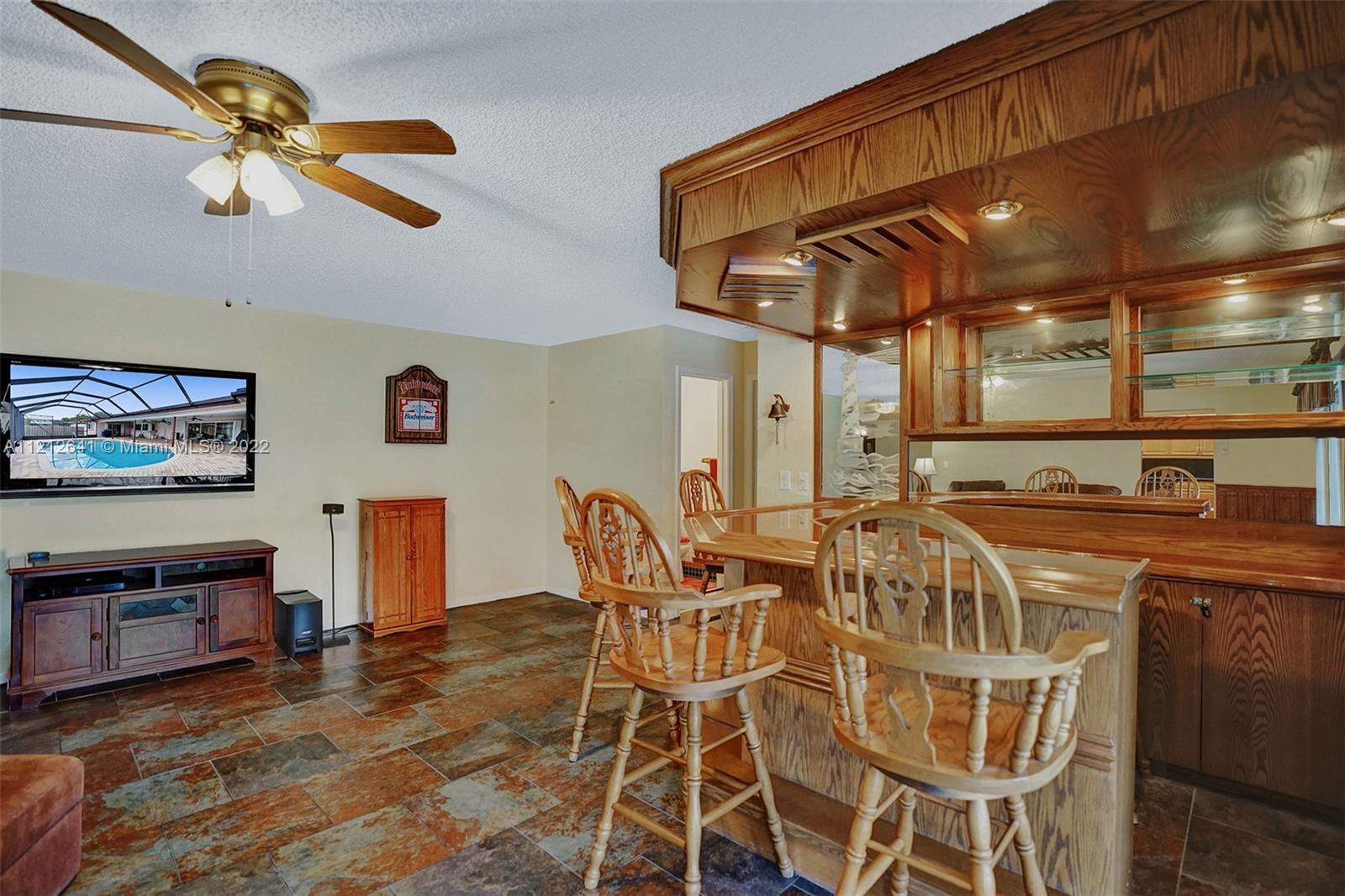 7420 Southwest 15th Street Plantation, FL 33317 - Photo 27 of 60 a view of a dining room with furniture and chandelier