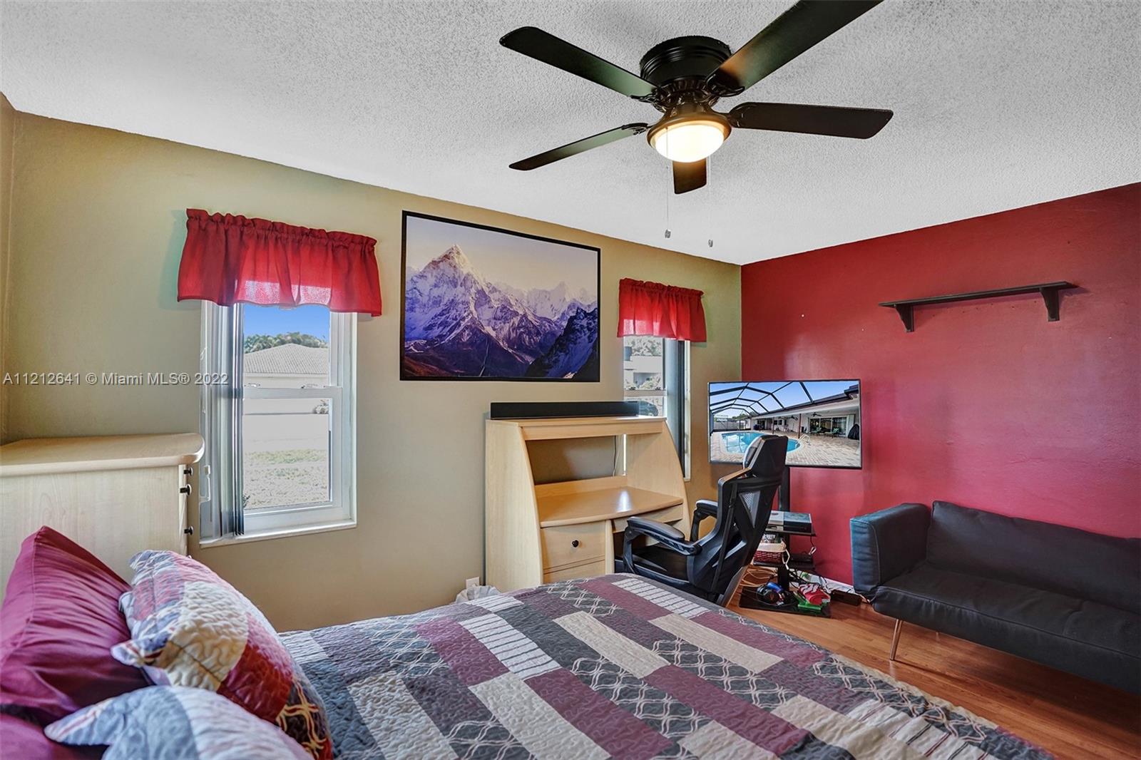 7420 Southwest 15th Street Plantation, FL 33317 - Photo 36 of 60 a bedroom with furniture and a bed