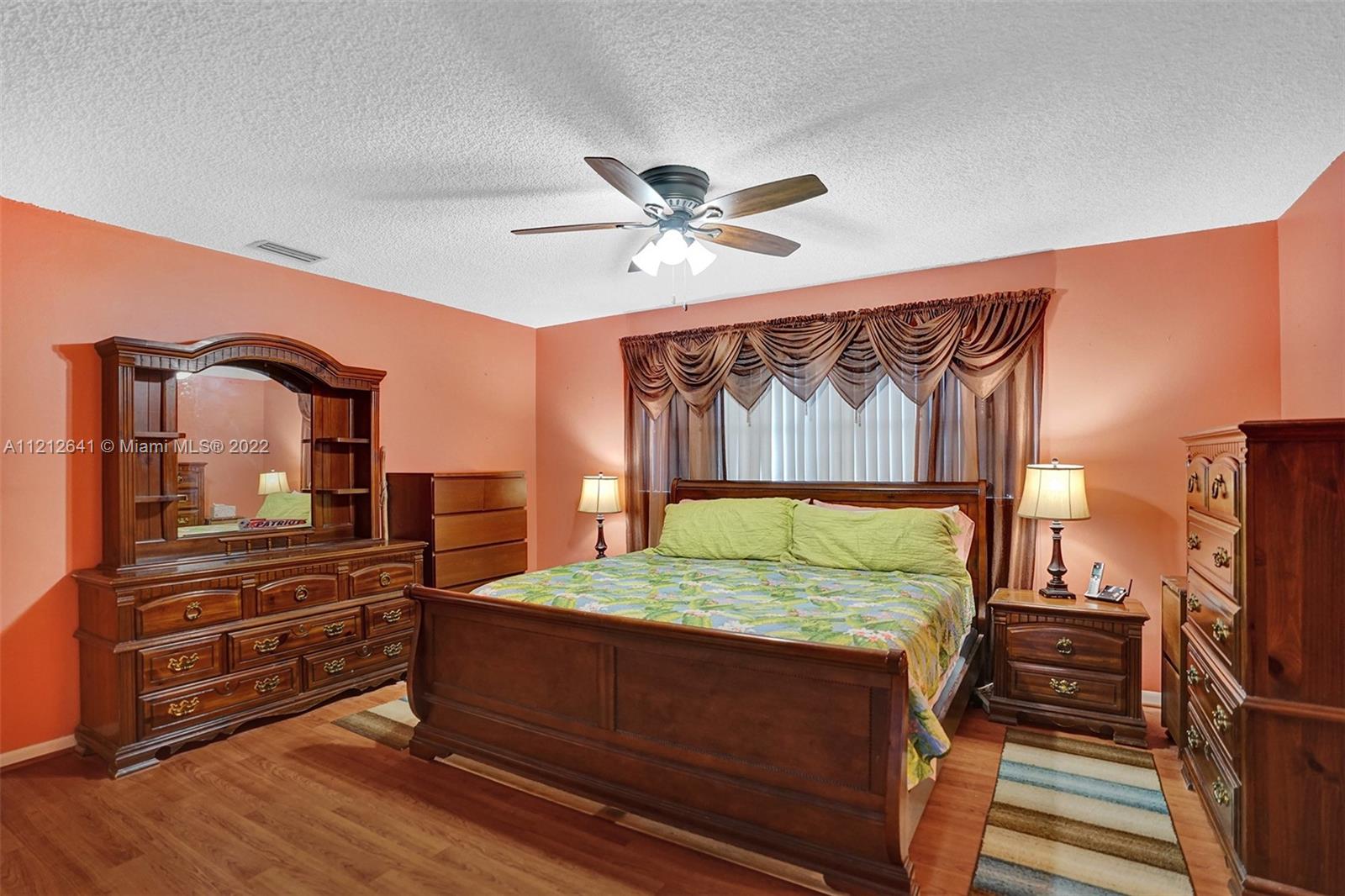 7420 Southwest 15th Street Plantation, FL 33317 - Photo 43 of 60 a bed room with a bed and a television
