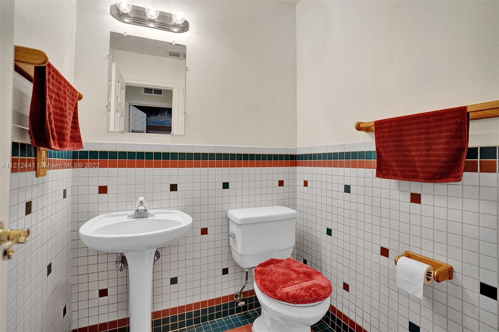 7420 Southwest 15th Street Plantation, FL 33317 - Photo 50 of 60 a bathroom with a sink toilet and mirror