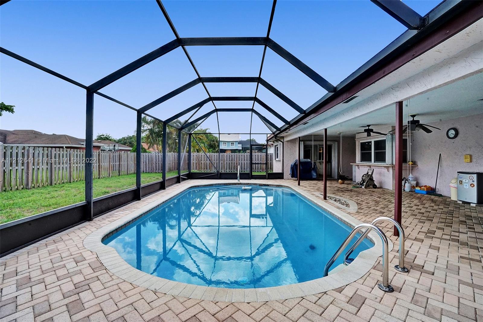 7420 Southwest 15th Street Plantation, FL 33317 - Photo 51 of 60 a view of a swimming pool with a patio