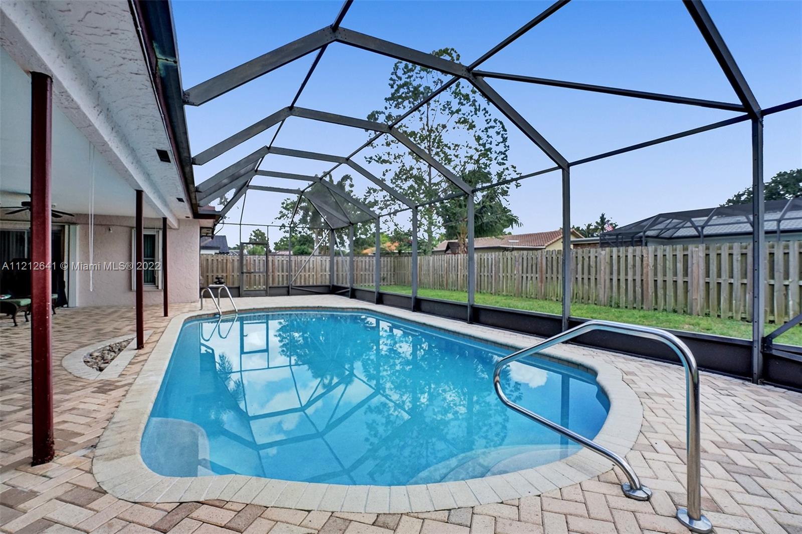 7420 Southwest 15th Street Plantation, FL 33317 - Photo 53 of 60 a view of a swimming pool with a patio