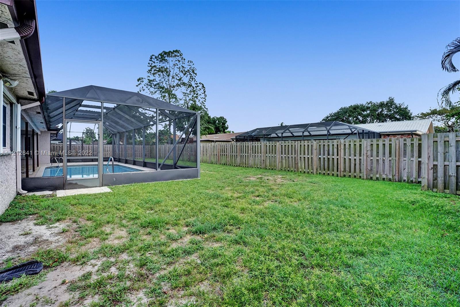 7420 Southwest 15th Street Plantation, FL 33317 - Photo 55 of 60 a view of a backyard with a garden and entertaining space