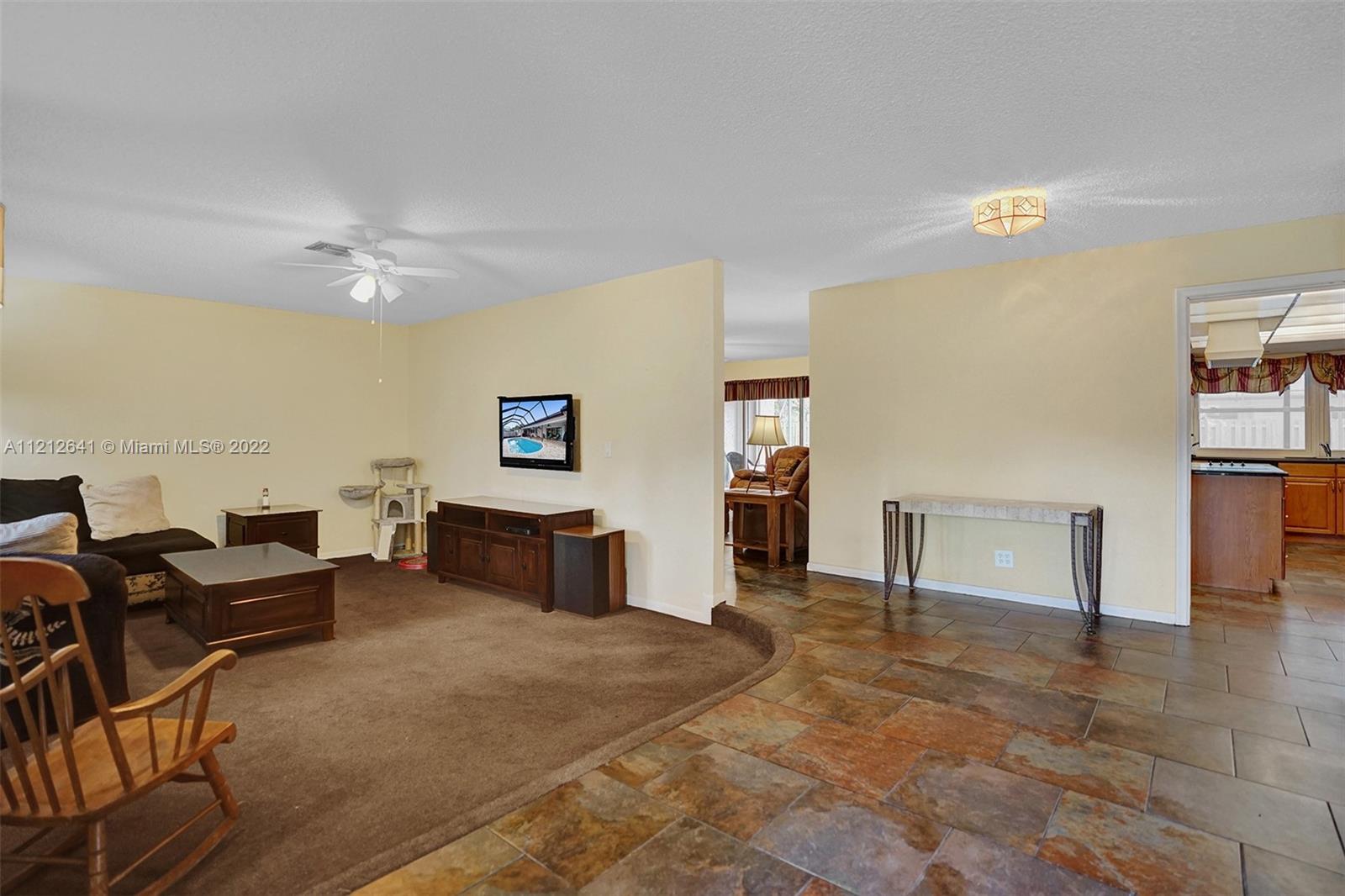 7420 Southwest 15th Street Plantation, FL 33317 - Photo 7 of 60 a living room with furniture and wooden floor