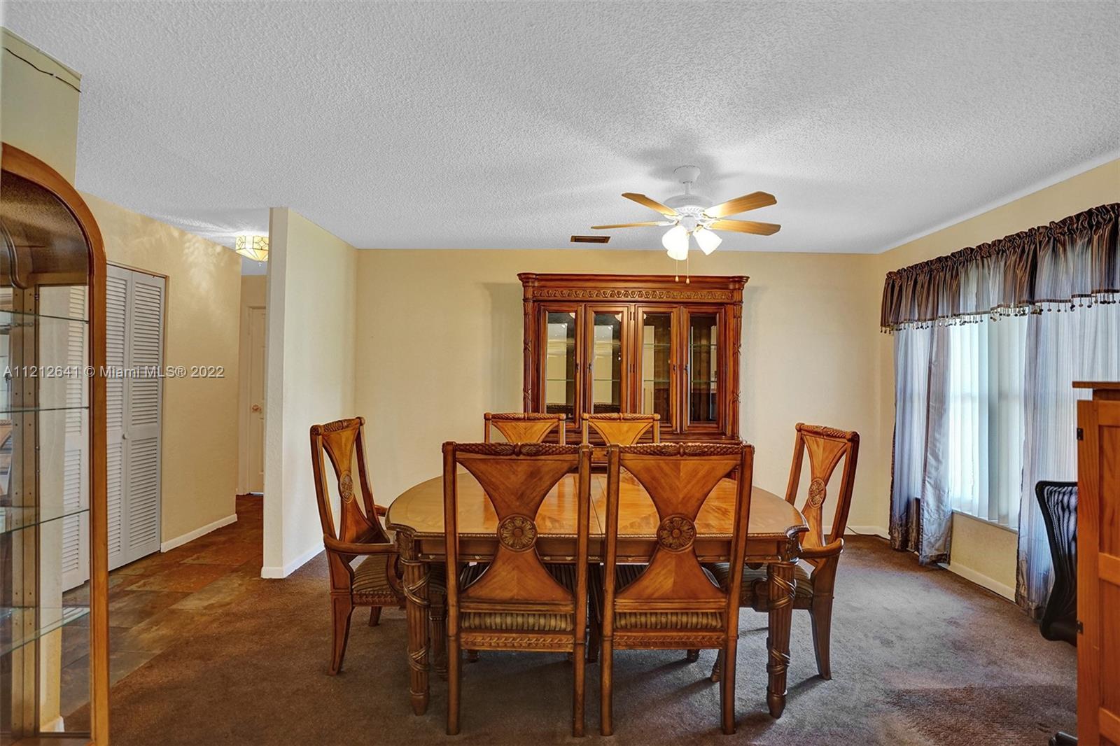 7420 Southwest 15th Street Plantation, FL 33317 - Photo 9 of 60 a dining room with furniture and window
