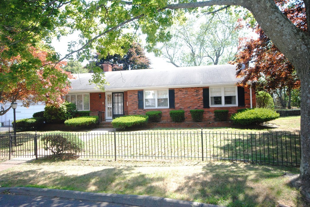 8 Quadrant Road Salem, MA 01970 - Photo 1 of 14 a front view of a house with a garden