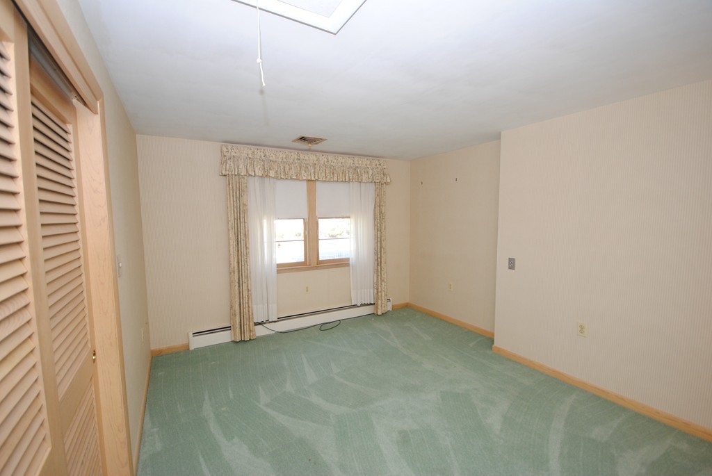 8 Quadrant Road Salem, MA 01970 - Photo 8 of 14 an empty room with windows