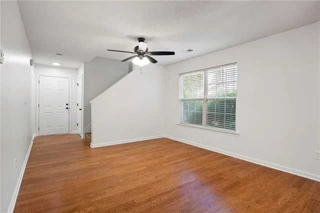 a view of an empty room with a window