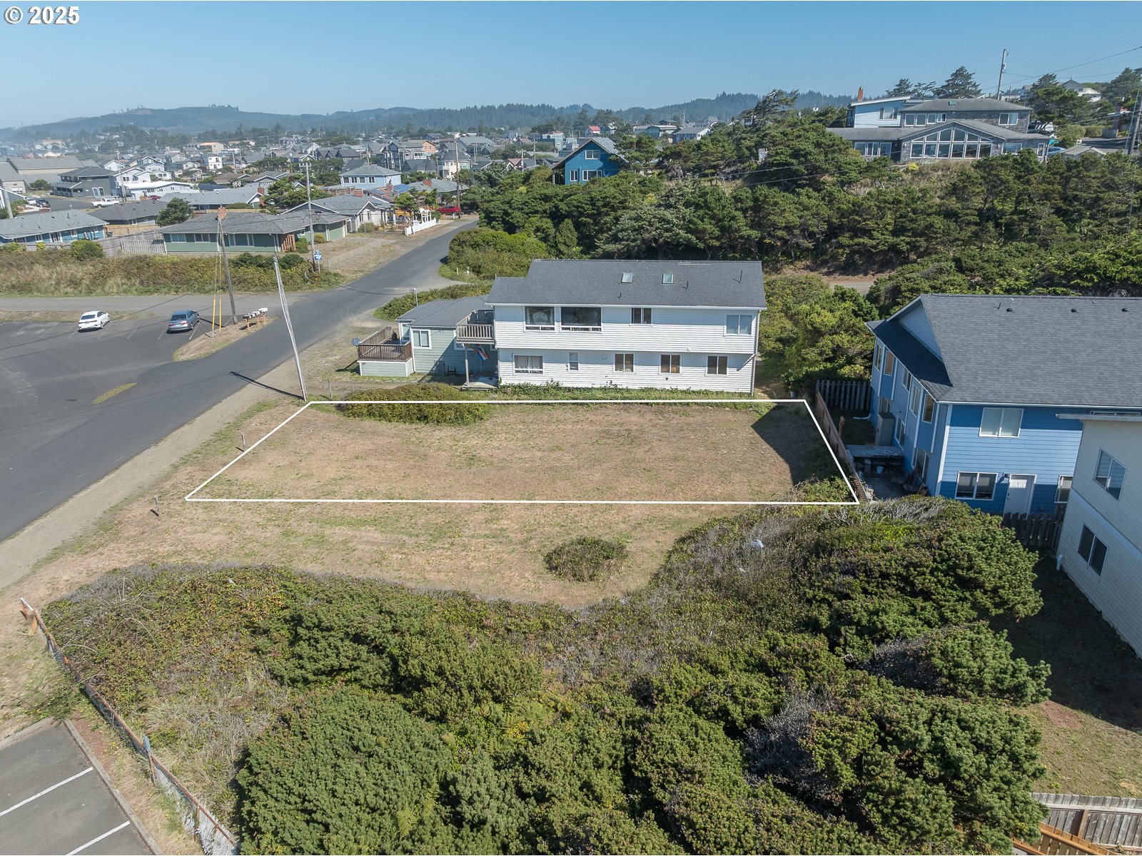 Undisclosed Address Newport, OR 97365 - Photo 4 of 16 an aerial view of residential houses with outdoor space