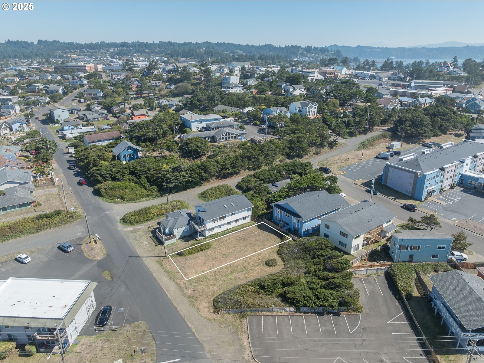 Undisclosed Address Newport, OR 97365 - Photo 9 of 16 an aerial view of residential houses with outdoor space