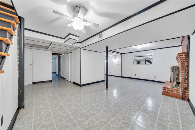 a view of a livingroom with a projector and furniture