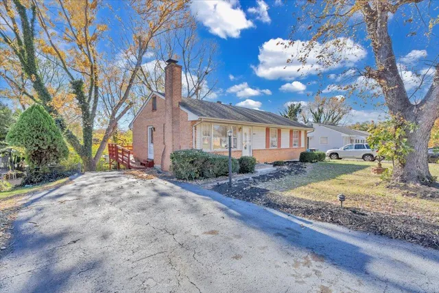 a view of a house with snow on the road