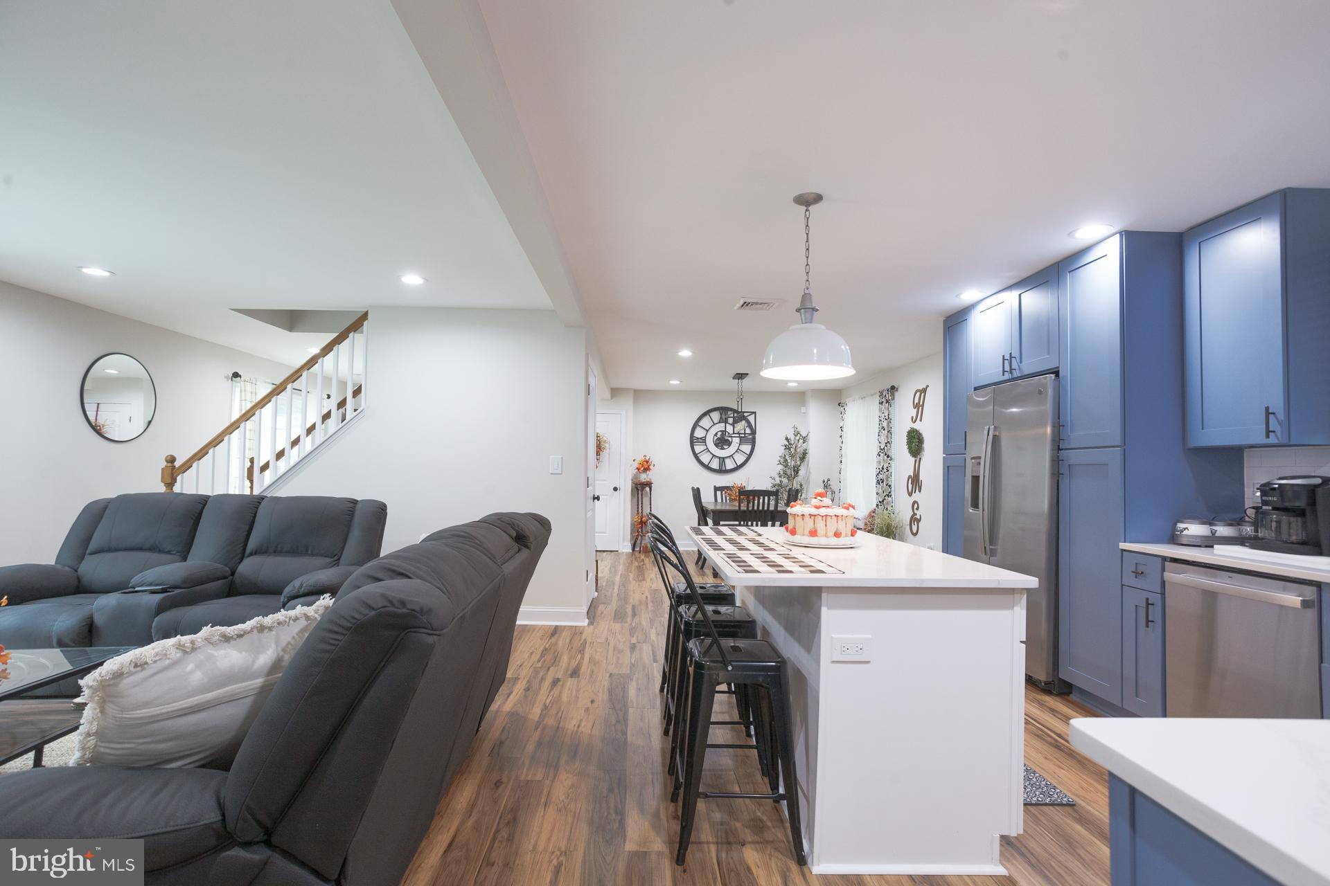 6 Hickory Lane Levittown, PA 19055 - Photo 12 of 32 a living room with furniture a dining table and chairs