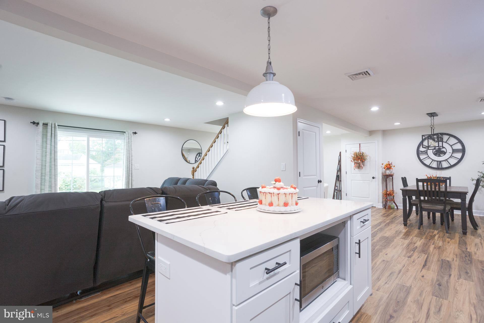 6 Hickory Lane Levittown, PA 19055 - Photo 13 of 32 a view of a dining room with furniture and wooden floor