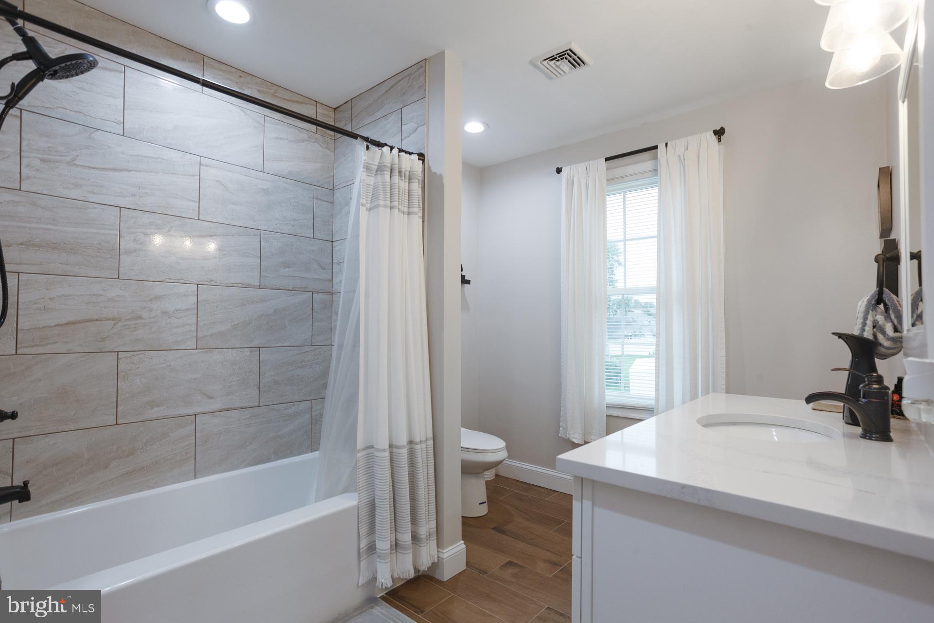 6 Hickory Lane Levittown, PA 19055 - Photo 22 of 32 a bathroom with a sink toilet and shower