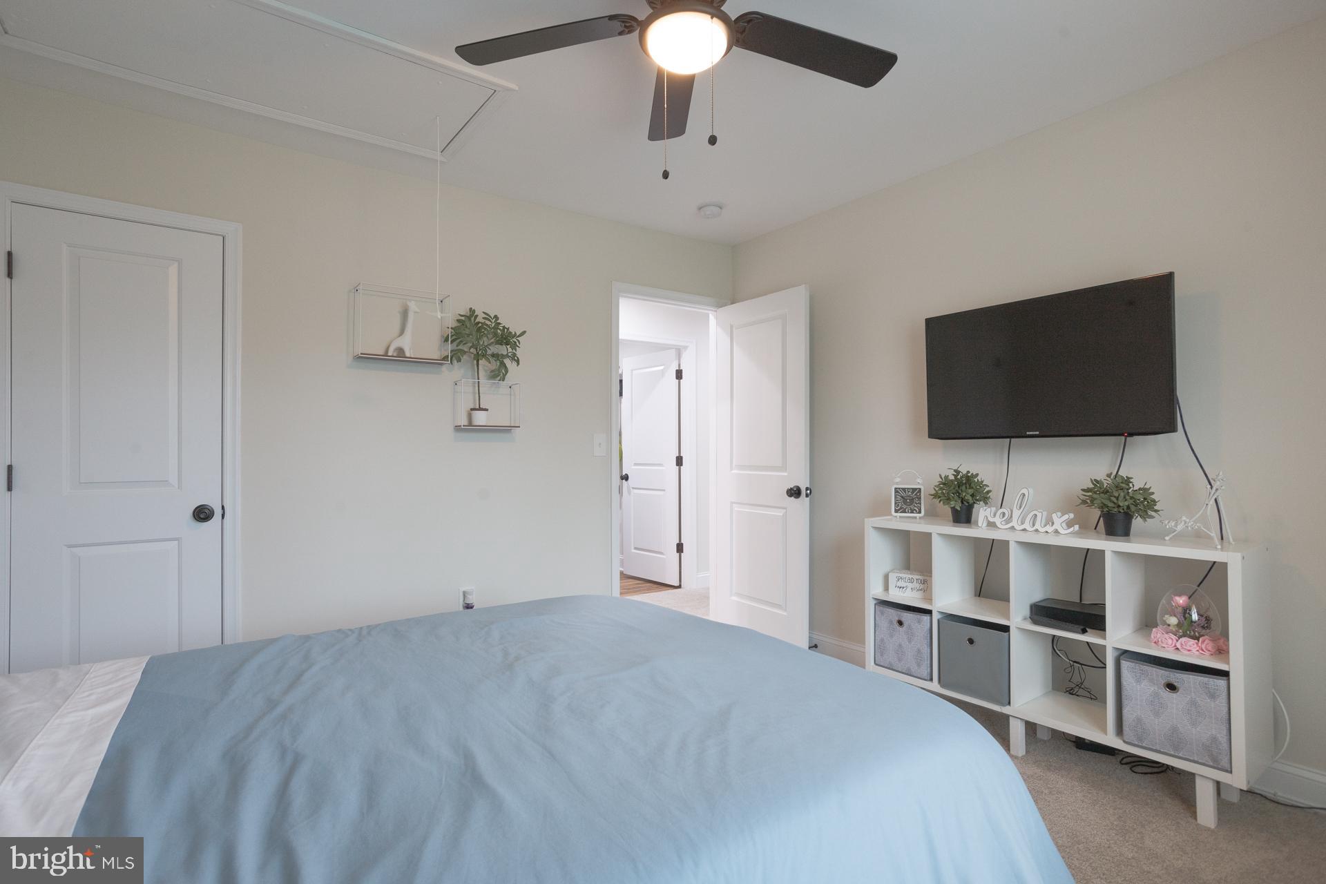 6 Hickory Lane Levittown, PA 19055 - Photo 25 of 32 a bedroom with a bed and a flat screen tv