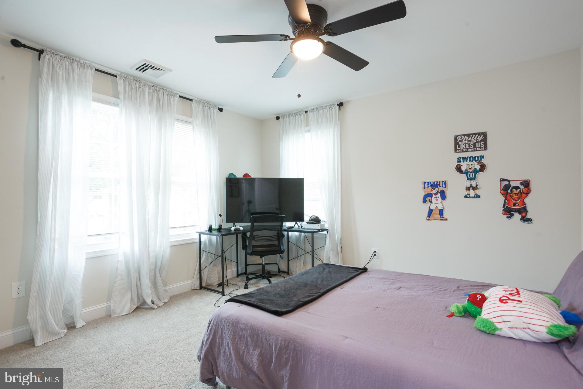 6 Hickory Lane Levittown, PA 19055 - Photo 26 of 32 a bedroom with a bed and a flat screen tv