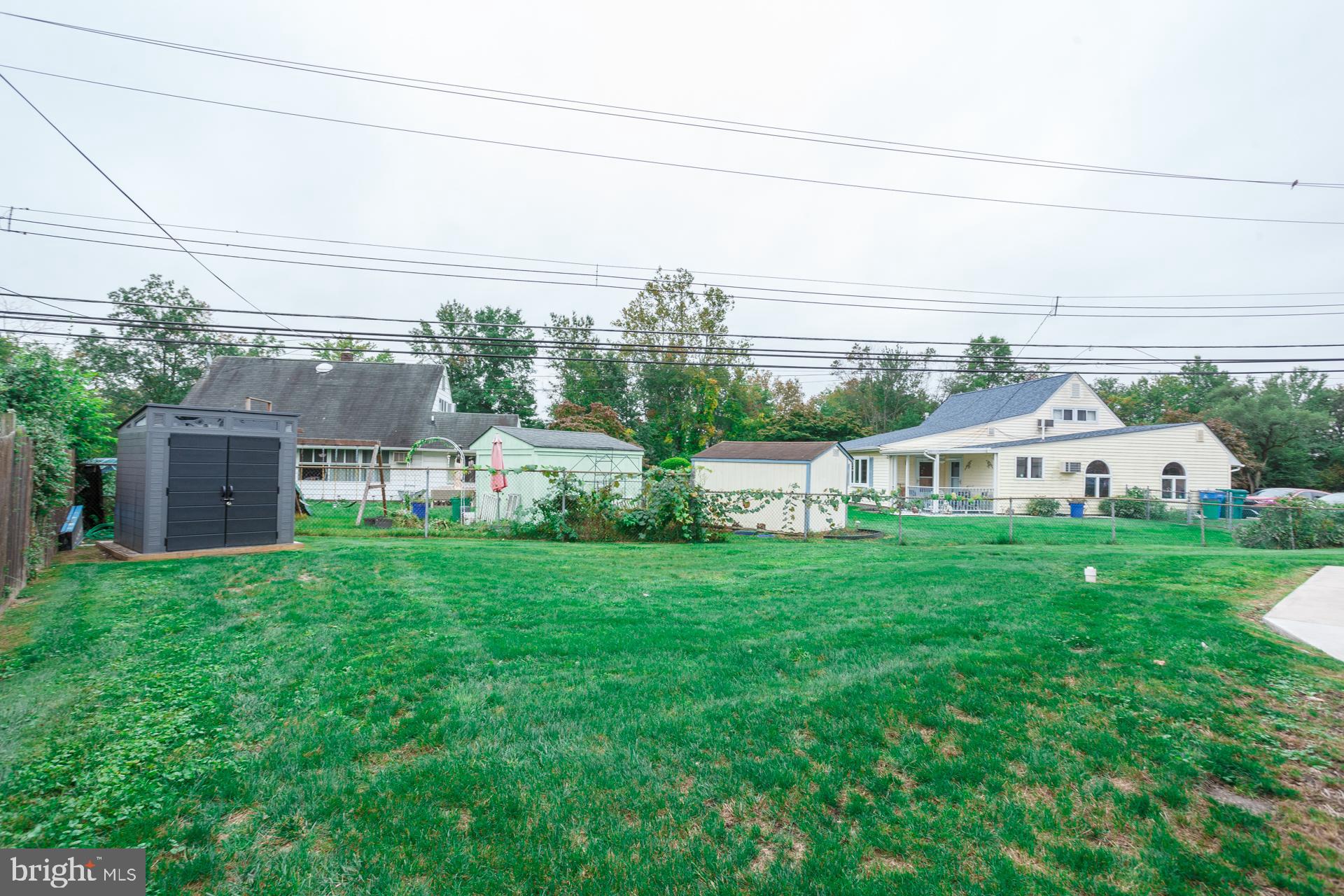 6 Hickory Lane Levittown, PA 19055 - Photo 32 of 32 a view of a house with a big yard plants and large trees