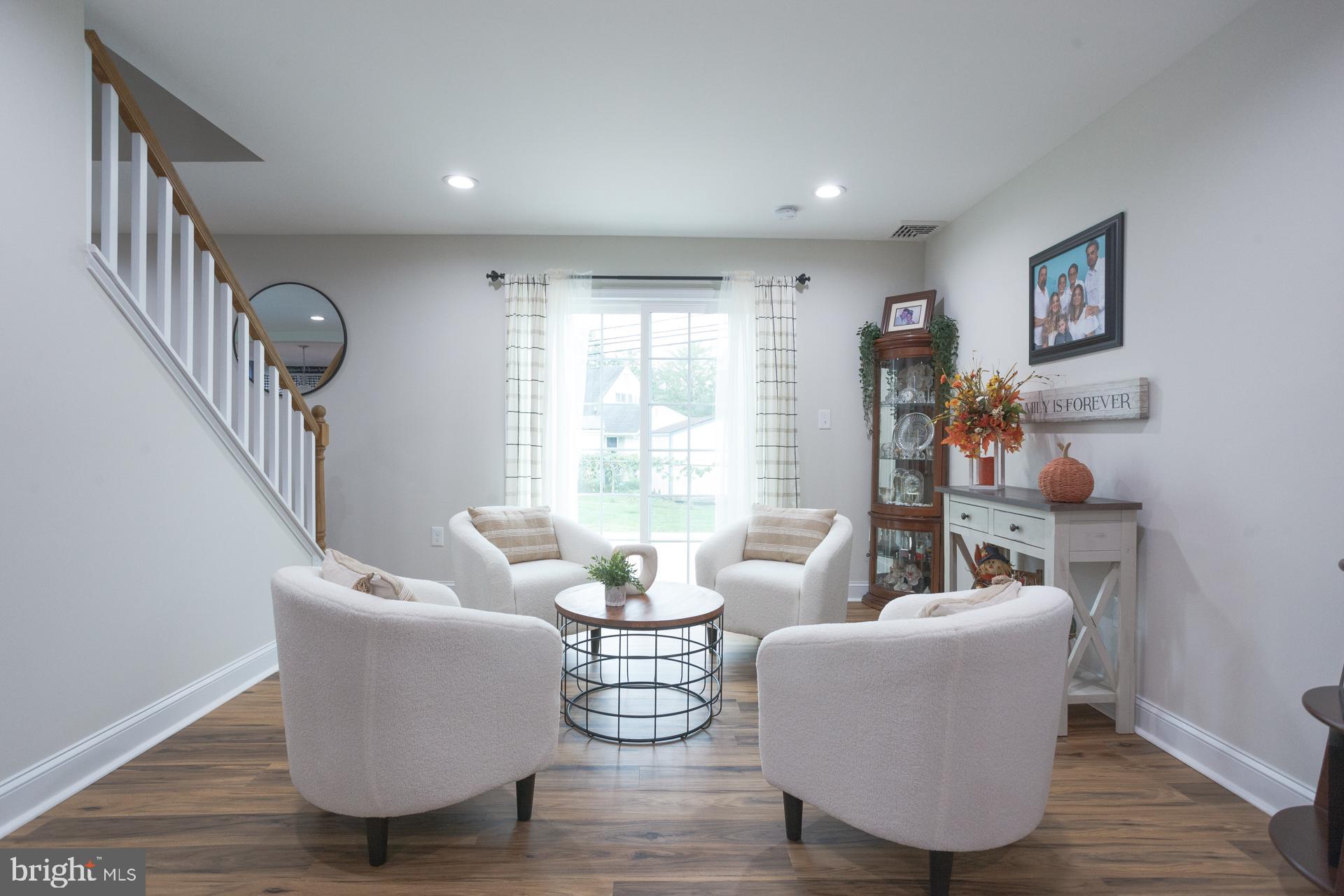 6 Hickory Lane Levittown, PA 19055 - Photo 6 of 32 a living room with fireplace furniture and a large window