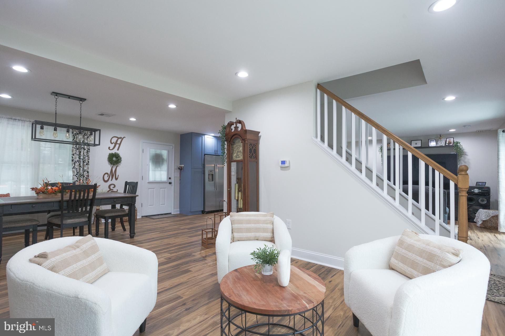 6 Hickory Lane Levittown, PA 19055 - Photo 7 of 32 a living room with furniture kitchen view and a wooden floor