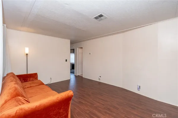 a bedroom with a bed and a flat tv screen