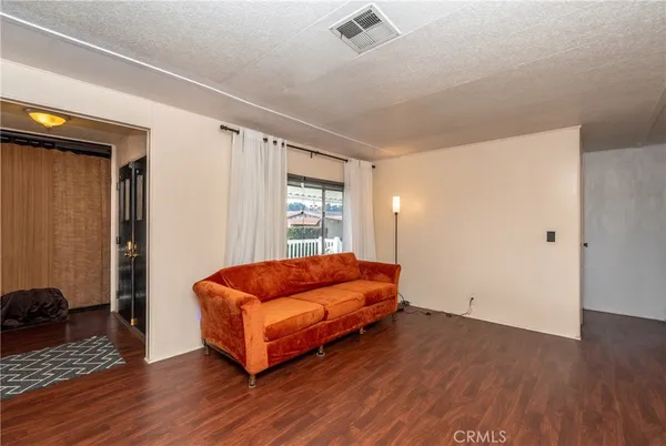 a kitchen with stainless steel appliances granite countertop a sink a stove a refrigerator and cabinets