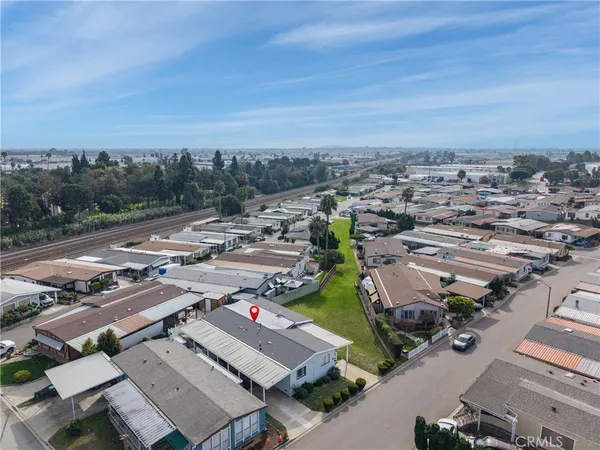an aerial view of residential building and car parked