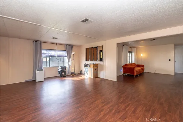 a spacious bathroom with a granite countertop sink and a mirror