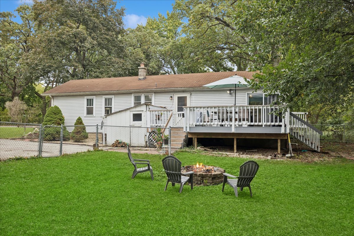 5116 Willow Drive Wonder Lake, IL 60097 - Photo 11 of 15 a view of a house with a yard porch and sitting area
