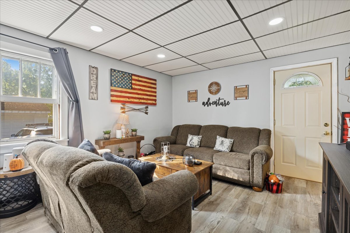 5116 Willow Drive Wonder Lake, IL 60097 - Photo 5 of 15 a living room with furniture and a large window