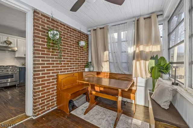 a view of a lounge chair and table in the backyard
