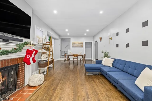 a living room with furniture and flat screen tv