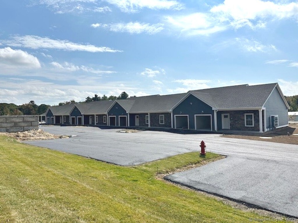 a view of a house with swimming pool and a yard