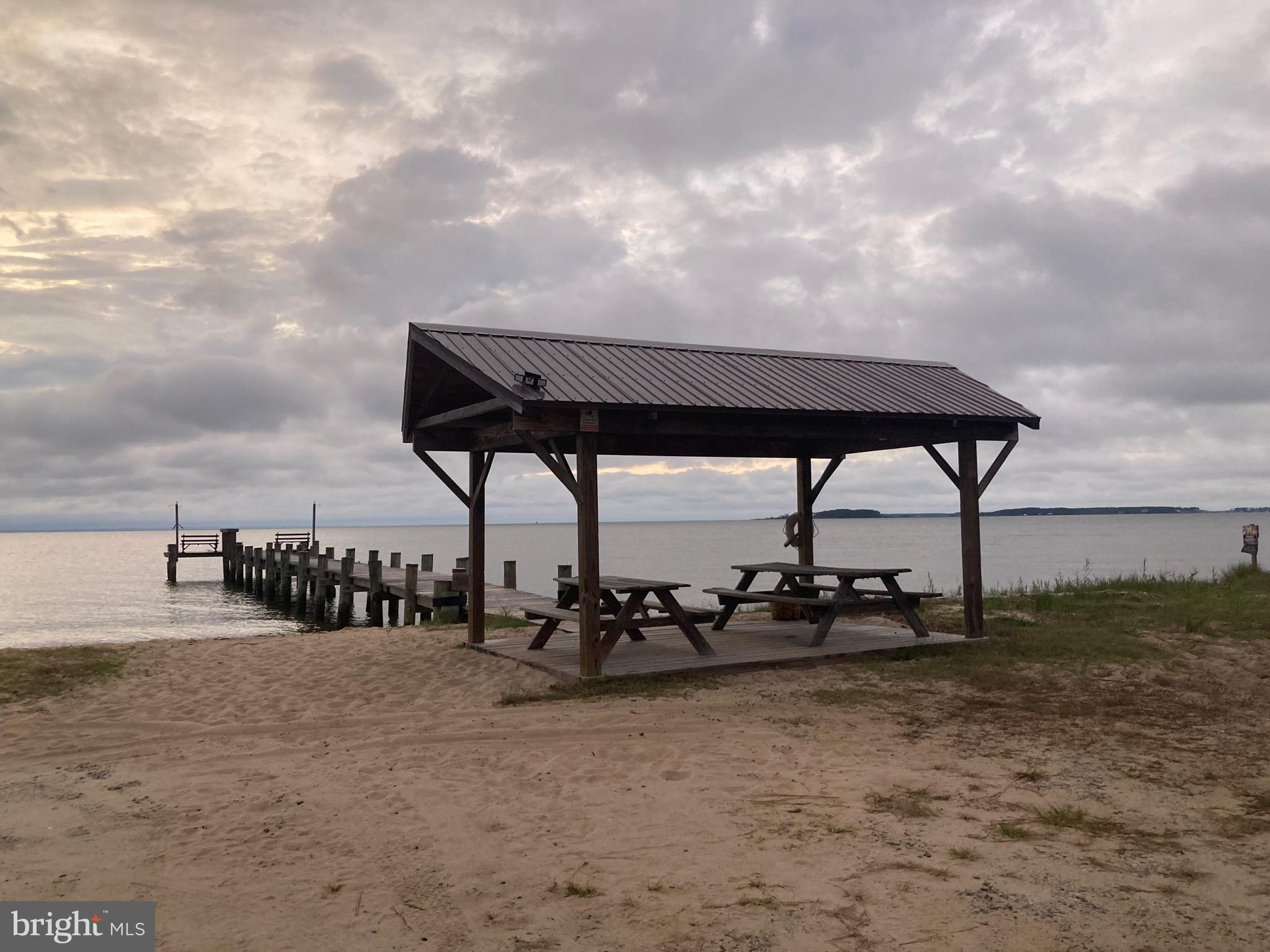 Parsons Drive Madison, MD 21648 - Photo 2 of 21 a backyard of a house with table and chairs