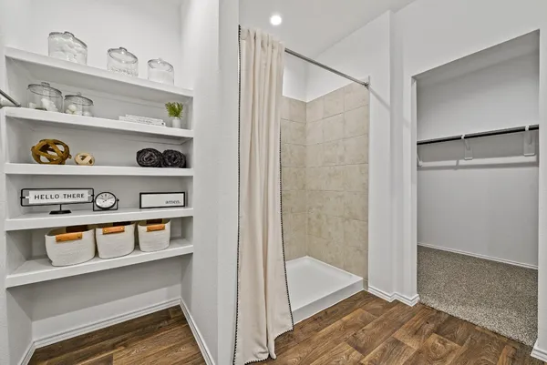 a view of an entryway with wooden floor