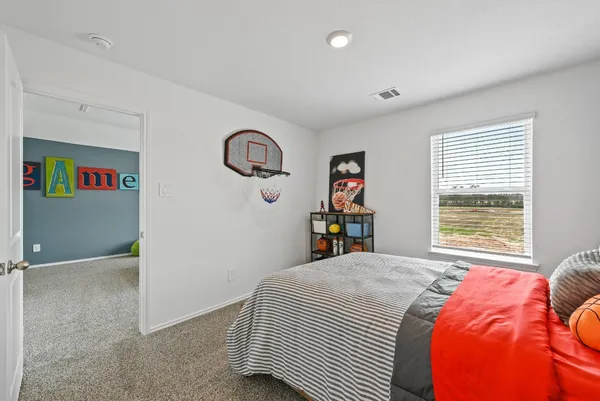 a room with toys and ceiling fan