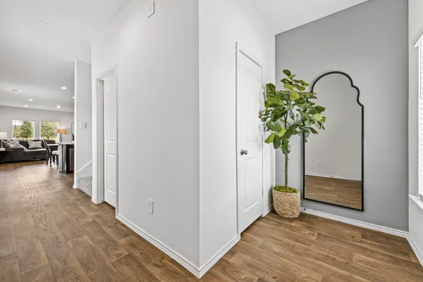 a view of a hallway with a potted plant