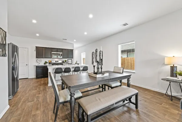 a view of a dining room with furniture and a wooden floor