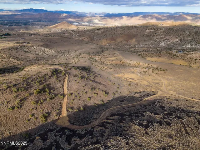 a view of a beach with mountains in the back