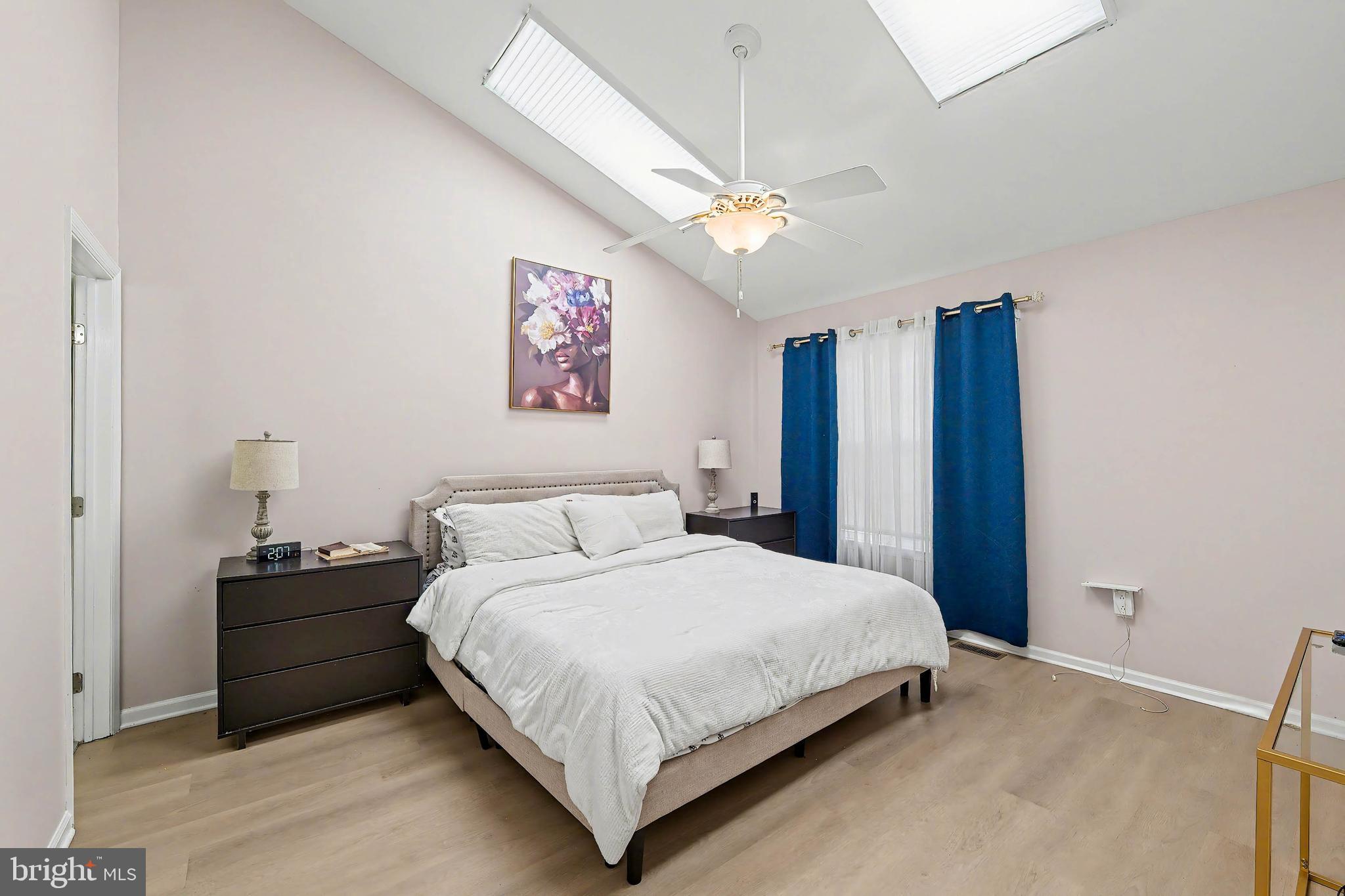 775 Quail Place Deptford, NJ 08096 - Photo 12 of 17 a bedroom with a large bed and a chandelier
